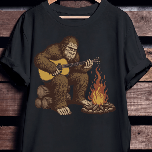 Bigfoot Sasquatch Playing Guitar by Campfire T-Shirt - The Music Frontiers