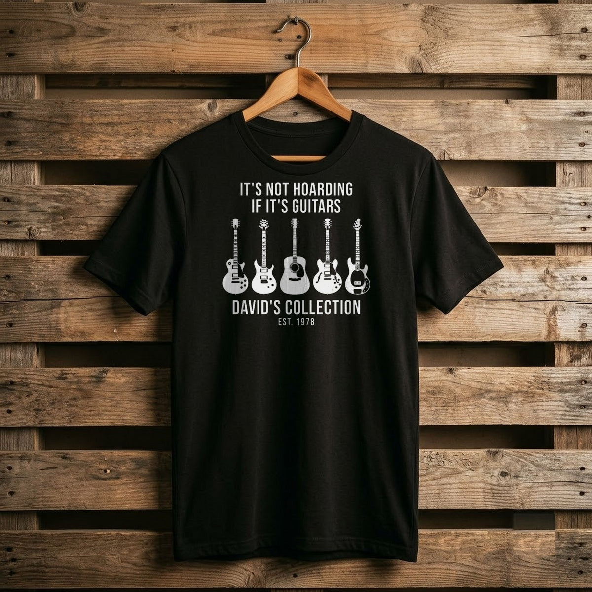 Black It's Not Hoarding If It's Guitars shirt with a row of white guitar shapes, a name and EST year