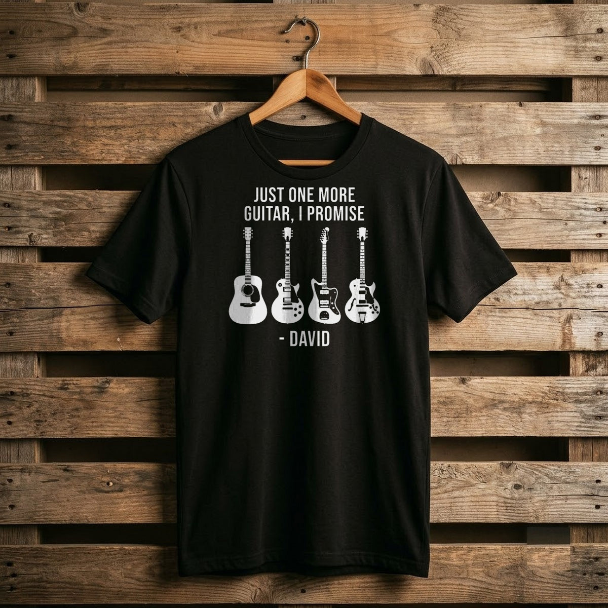 Black Just One More Guitar I Promise shirt with white guitar silhouettes and a name