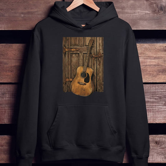 Rustic Vintage Guitar Against Door