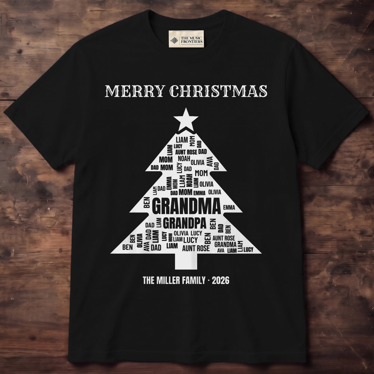 Red tee with family names arranged in the shape of a Christmas tree above THE MILLERS 2026