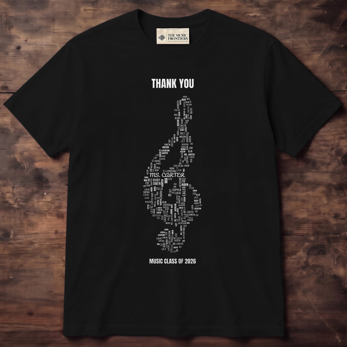 Navy tee with student names forming a treble clef above MRS. HARPER 2026