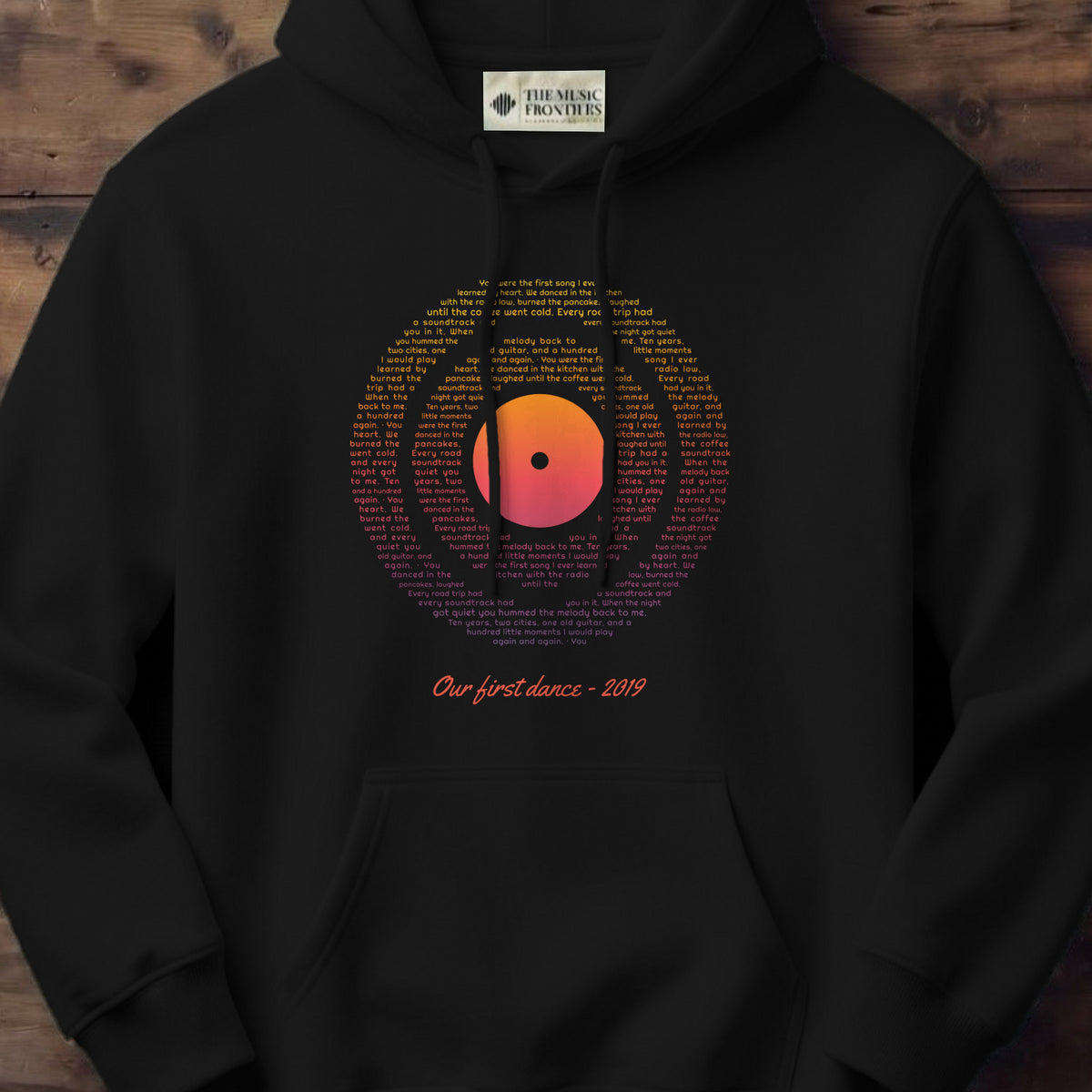 Black hoodie with the personalized Vinyl Record Sunset Lyrics design
