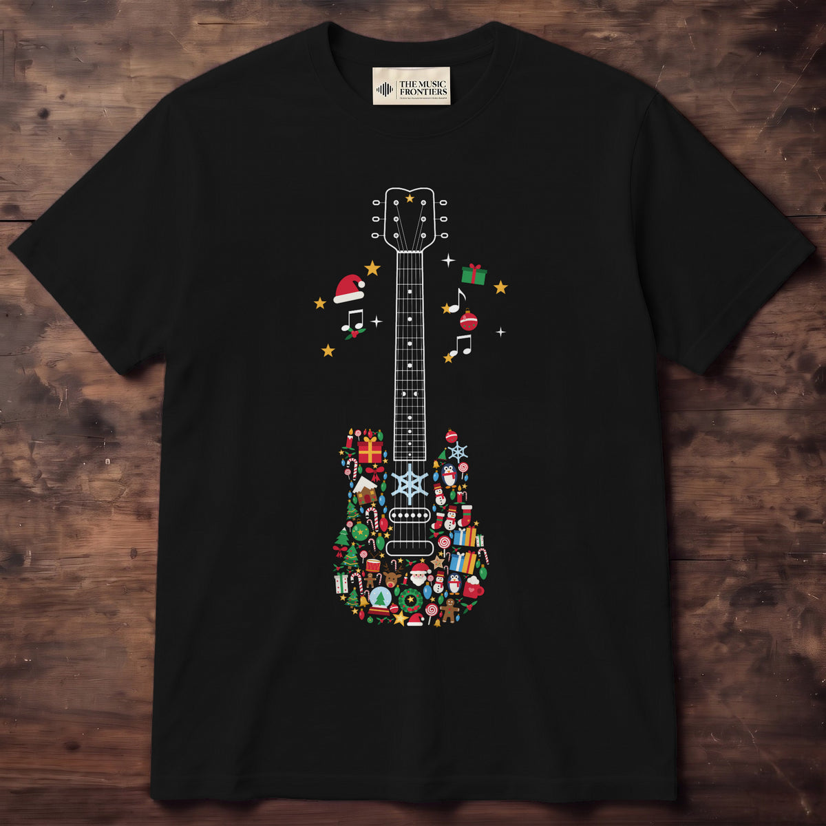 Black shirt with a white line guitar neck and a body made of colorful Christmas icons, notes and Santa hats beside the neck