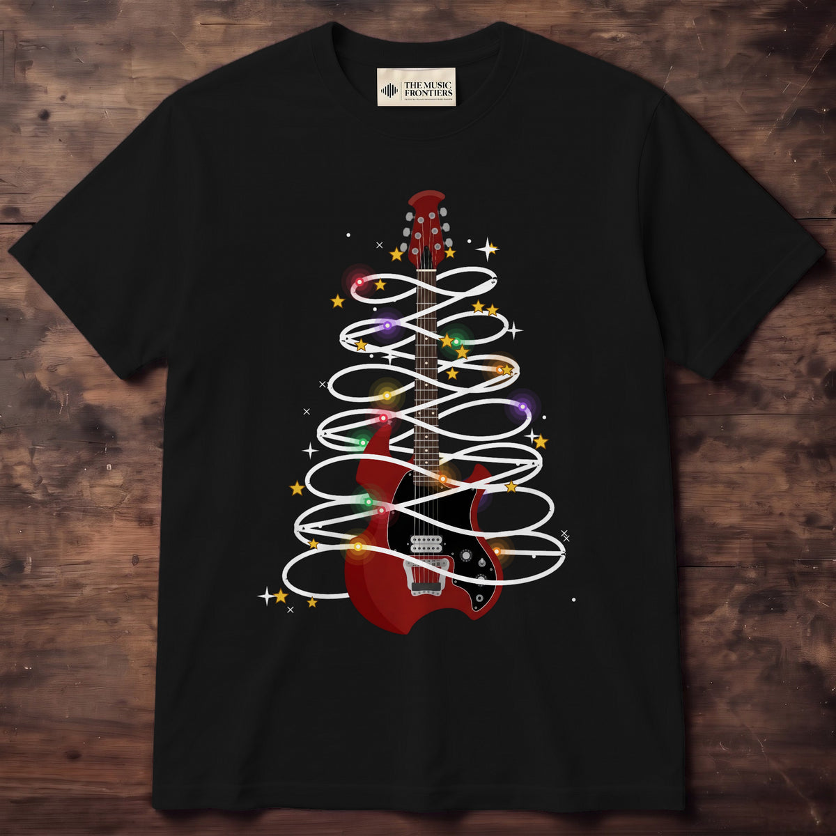 Shirt with a big red electric guitar wrapped in a black string of glowing Christmas lights with gold stars and sparkles