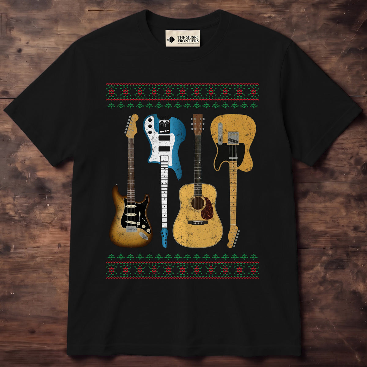 Black shirt with red and green knit-style snowflake borders and four full-color guitars, alternating upright and upside down