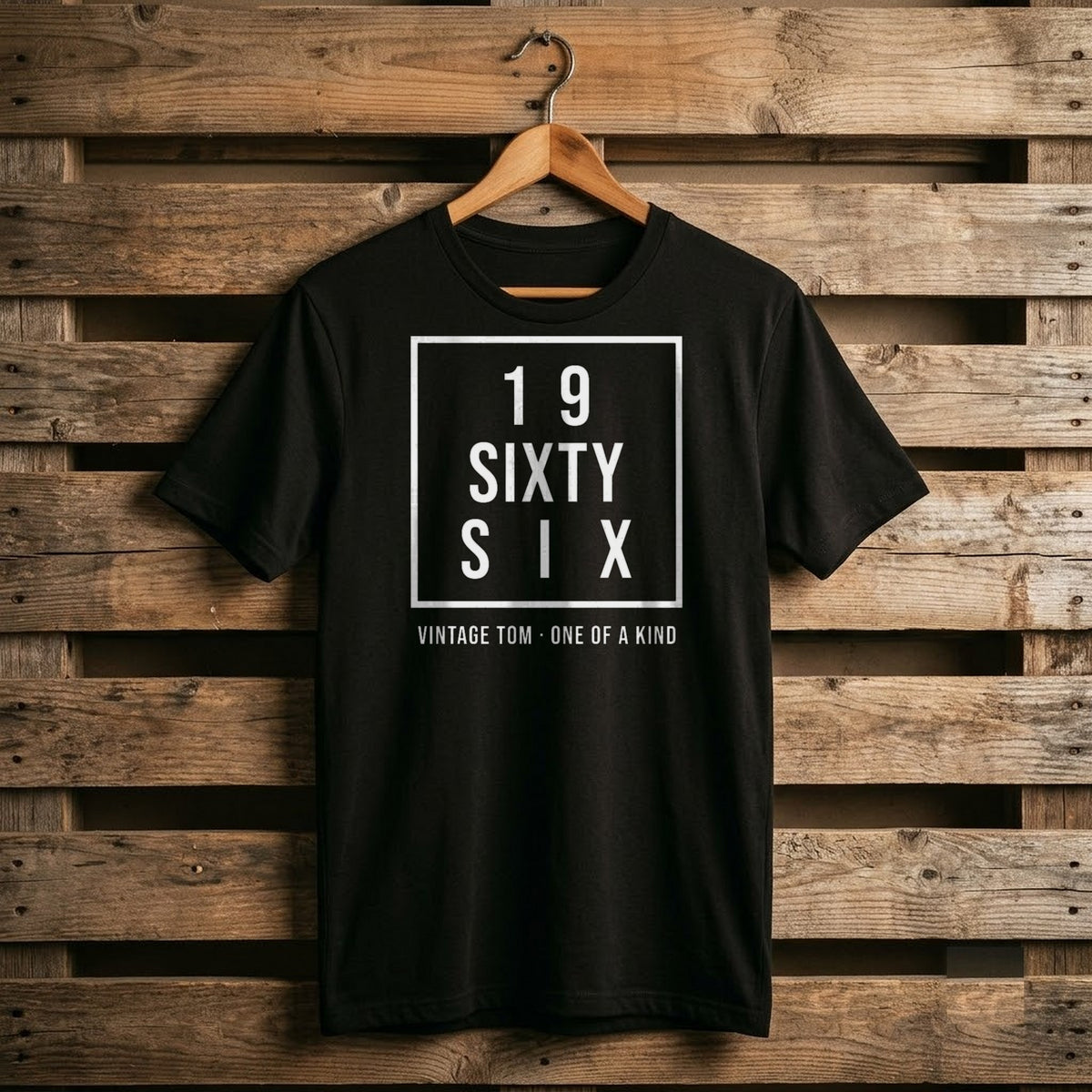 Black shirt with a white square block reading 19 / SIXTY / SIX and Vintage Tom